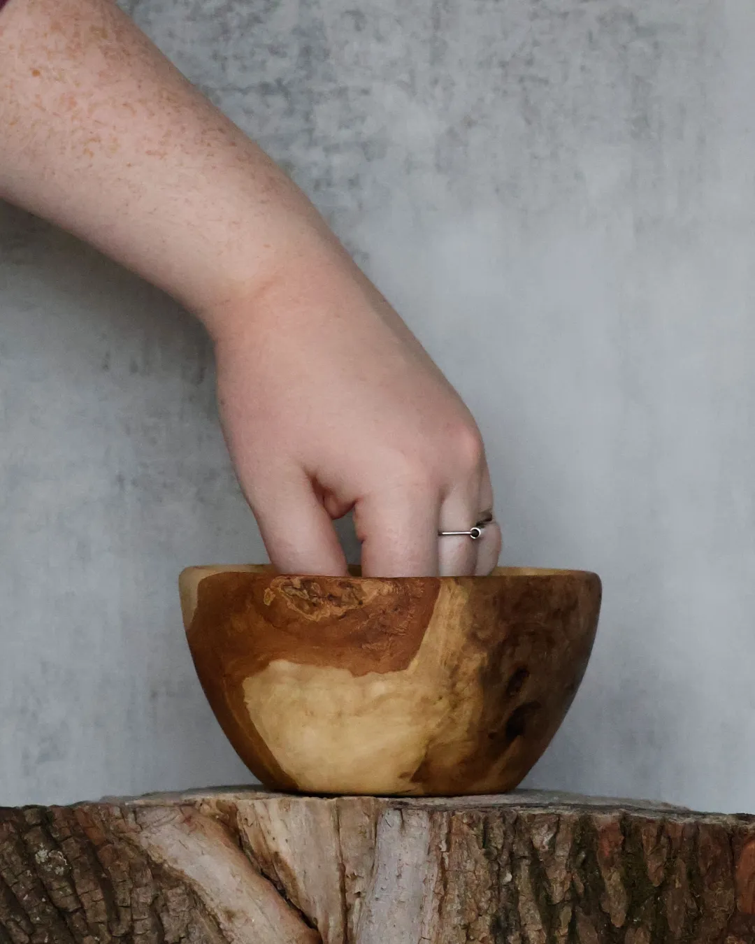 Hand-turned burl wood bowl with contrasting heartwood and sapwood