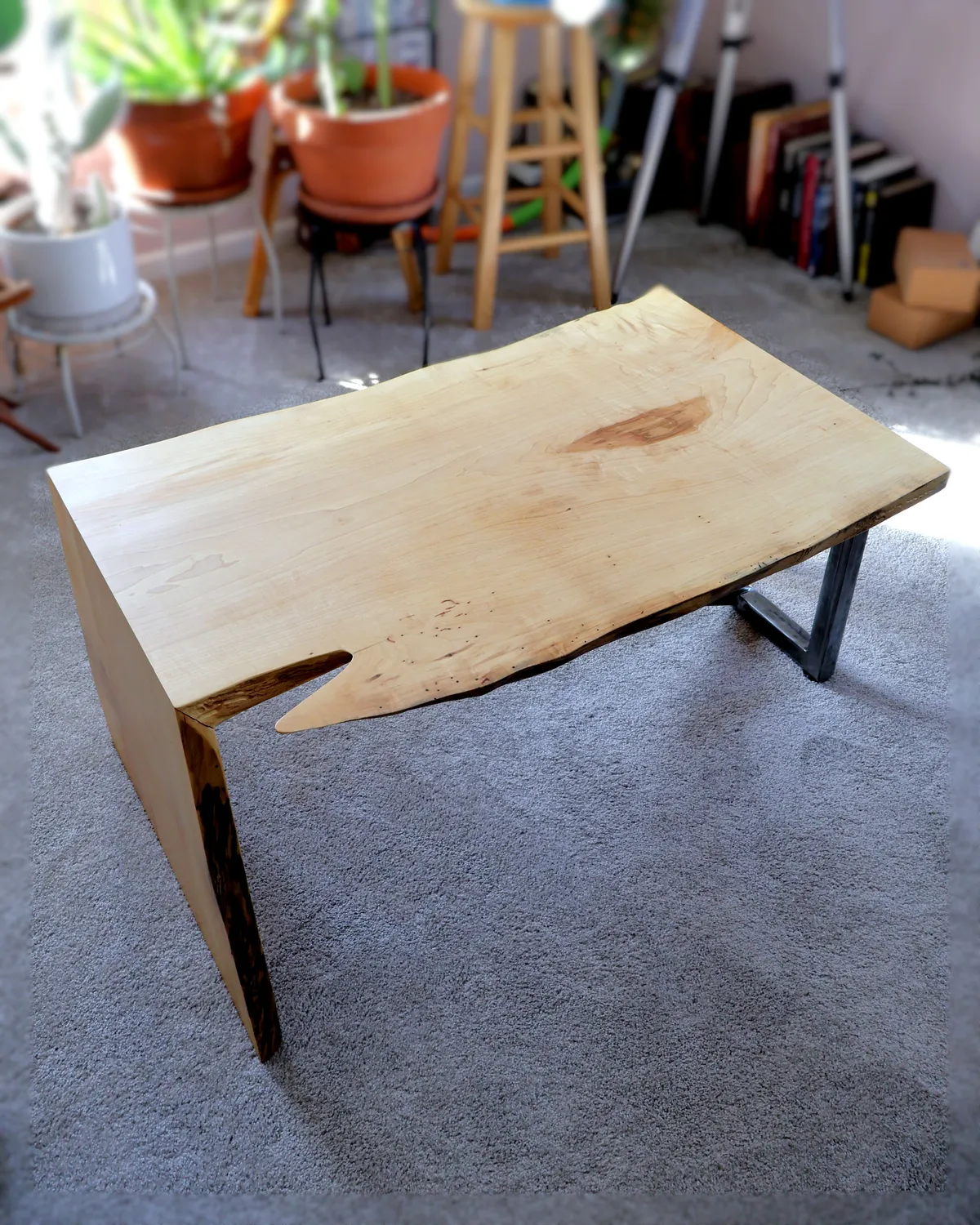 Handcrafted live-edge maple waterfall coffee table with steel leg