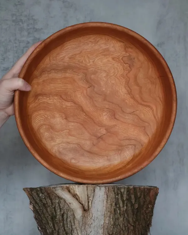 Top view of hand-turned cherry bowl showing swirling grain pattern